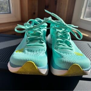 Teal Athletic Running Shoes with Yellow Accents